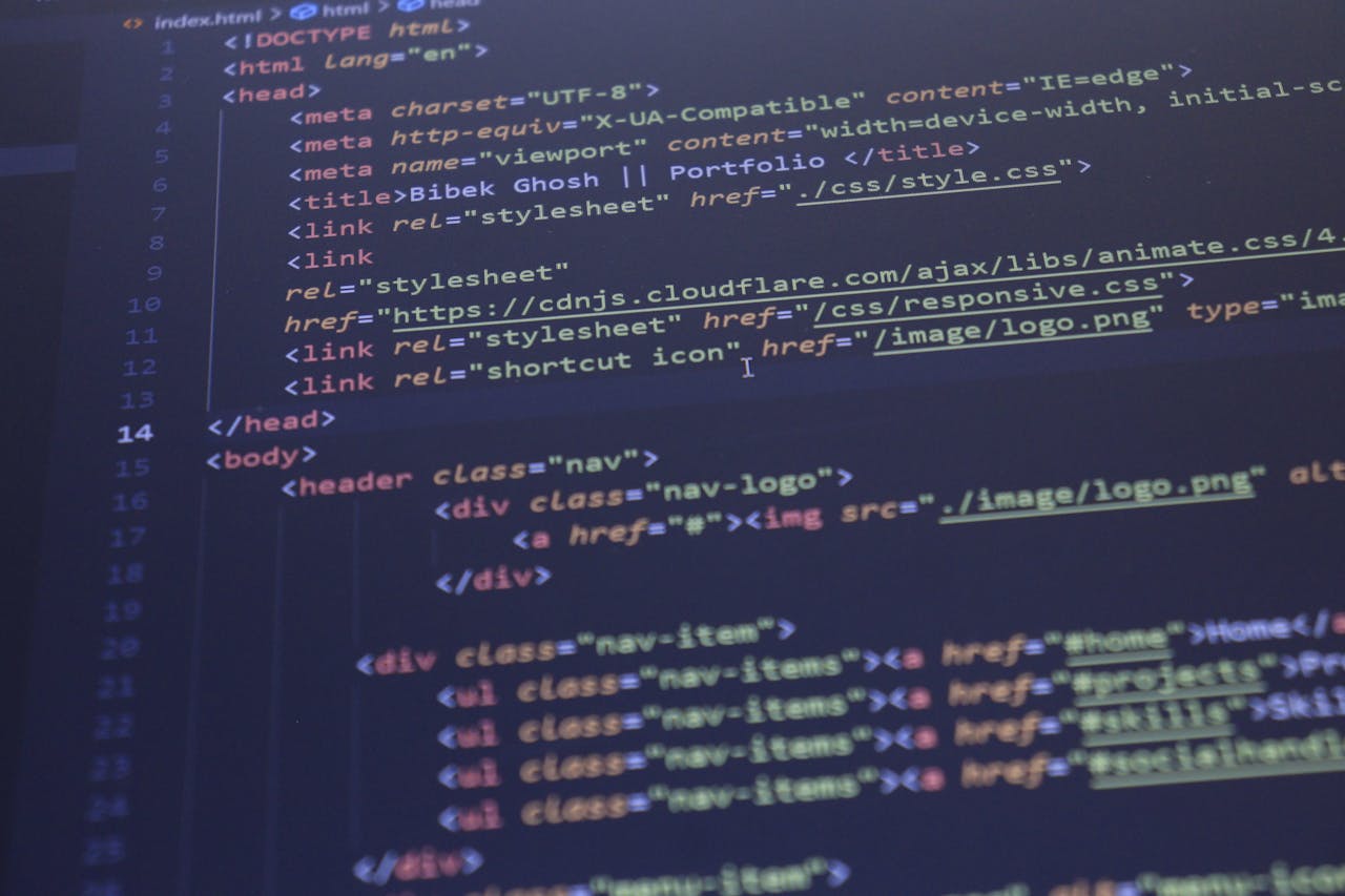 our-experience Close-up view of HTML and CSS code displayed on a computer screen, ideal for programming and technology themes.