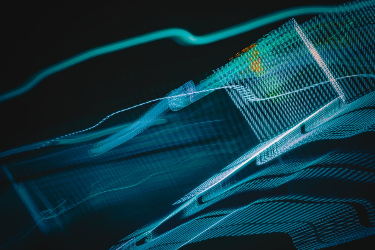 about-img Abstract digital artwork with blue light streaks on a dark background, creating a futuristic feel.